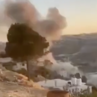 Smoke rises from the reported point of impact of a Houthi missile in Sa'ir, a Palestinian town near Hebron in the southern West Bank, June 14, 2025. (Screen capture: Shehab News Agency)